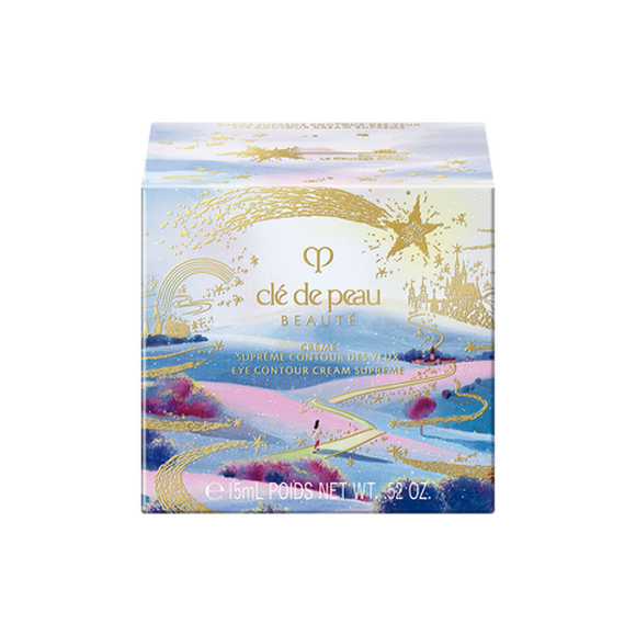 Photo of the 26 AW Holiday Collection limited-edition EYE CONTOUR CREAM SUPREME outer box. The square package features a scenic illustration of a path leading toward a castle under a starry sky, with a large gold shooting star across the top.